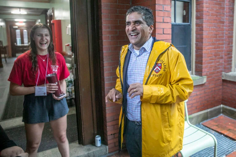 Dean Rakesh Khurana enjoys a good laugh with undergrad Sydney Levy while helping fist years move in to Matthews Hall. Photo: Jon Chase