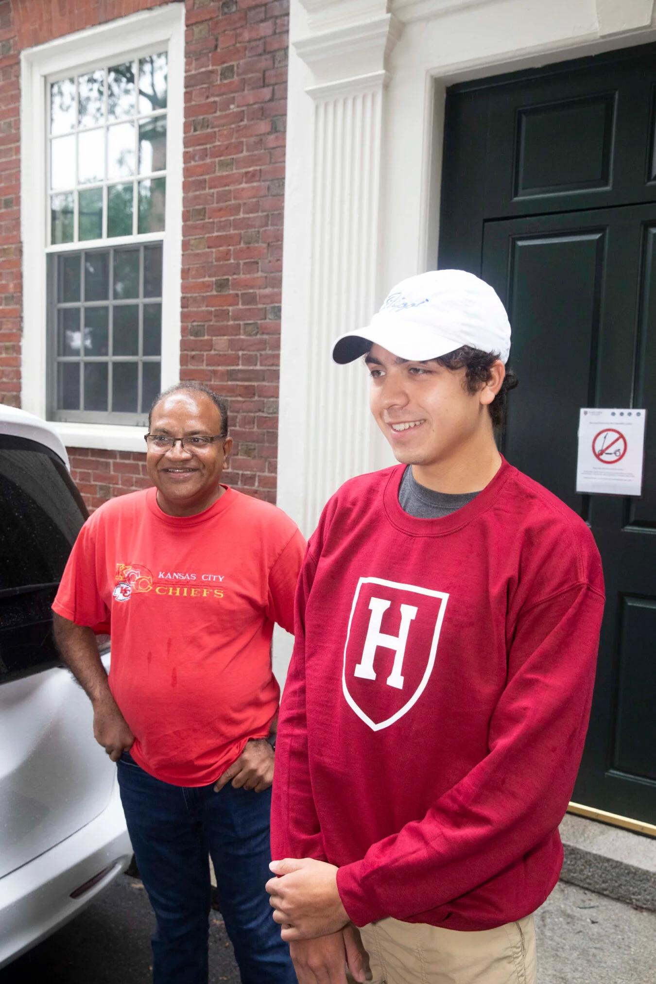 Sharat Ramaraju with son Nikhil Ramaraju in front of Wigglesworth Hall. Photo: Kris Snibbe