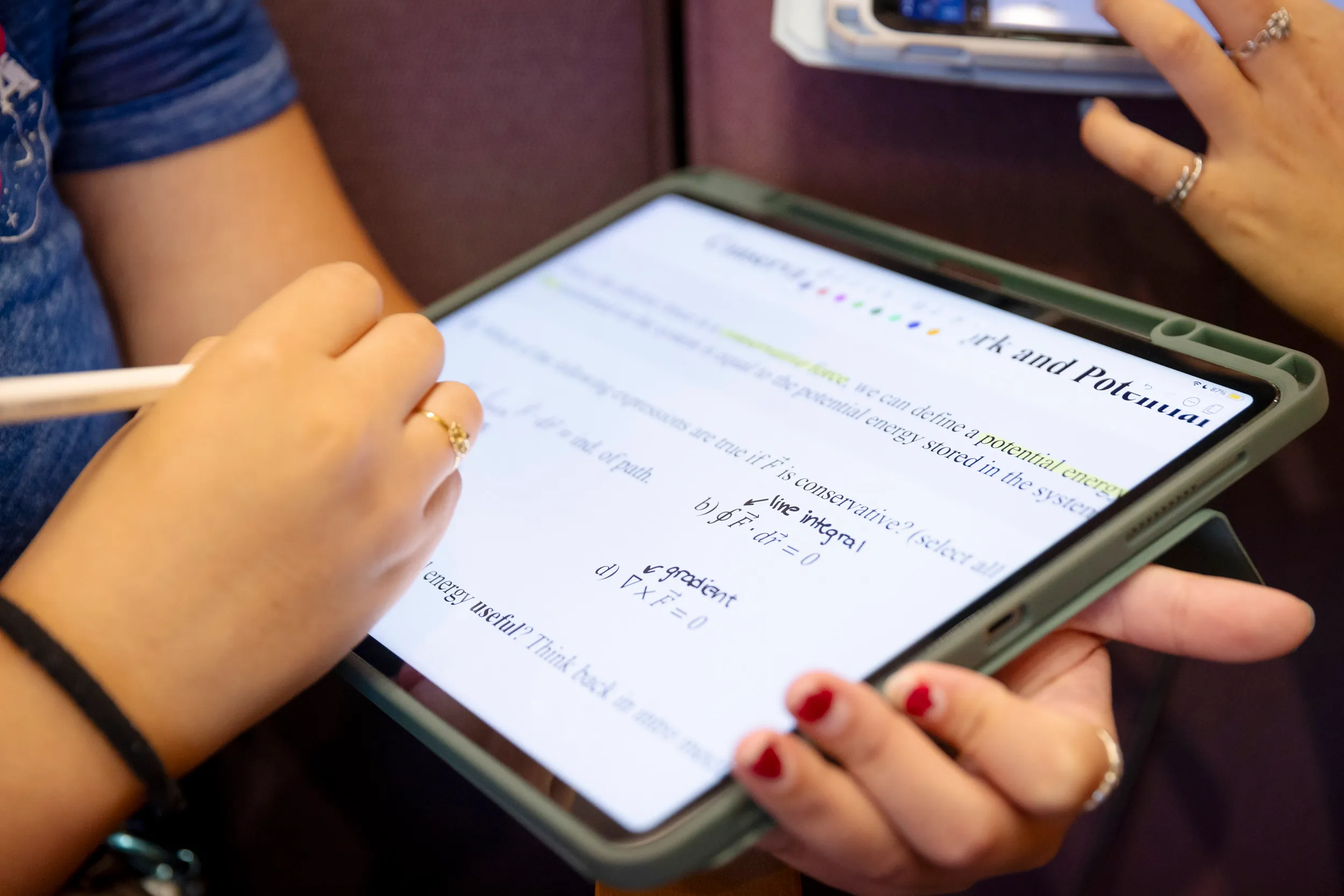 A student works on an iPad during a physics class taught in the Science Center Hall A. Niles Singer/Harvard Staff Photographer