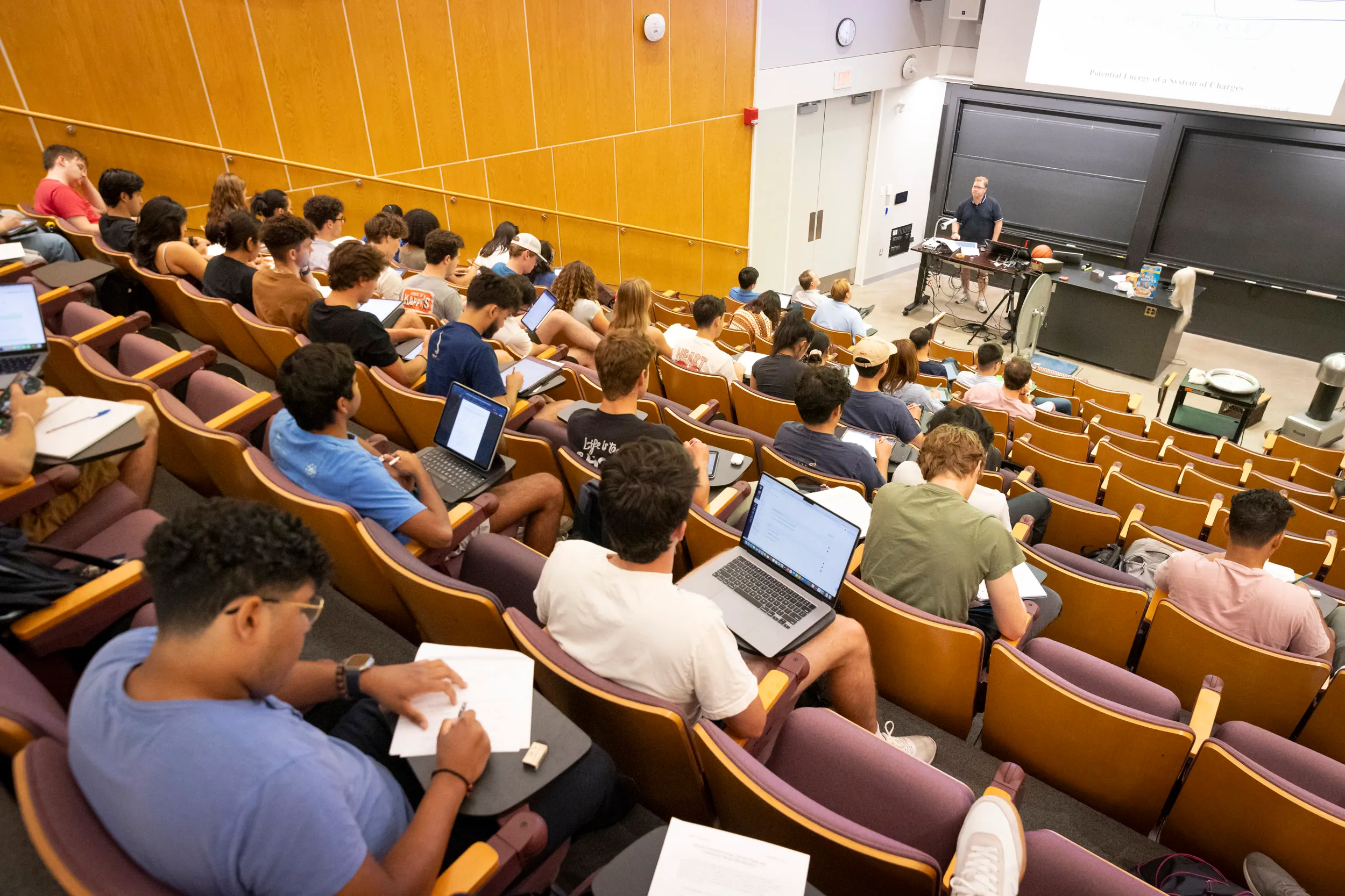 Senior preceptor in physics Louis Deslauriers offers students demonstrations during “Introductory Electromagnetism Physics.” Niles Singer/Harvard Staff Photographer