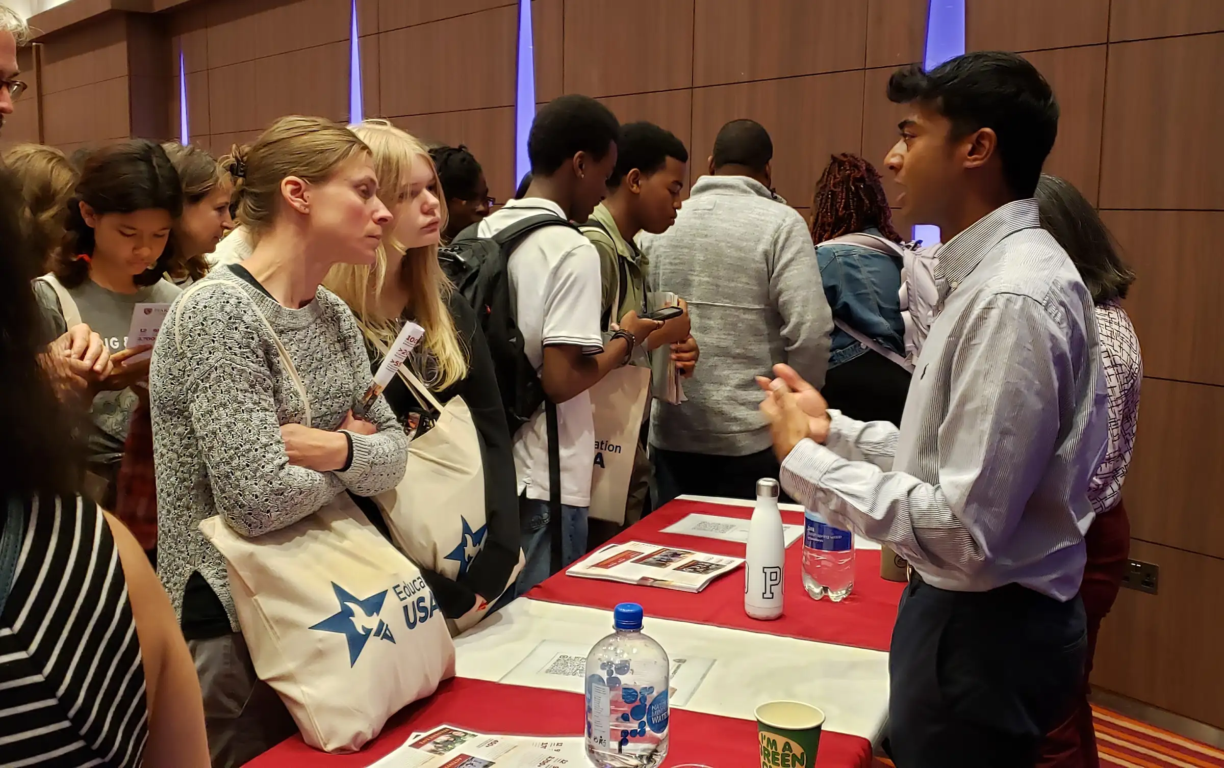 Yousuf Amiel Bakshi (Harvard Class of 2023) speaks to visitors at last year's USA College Day